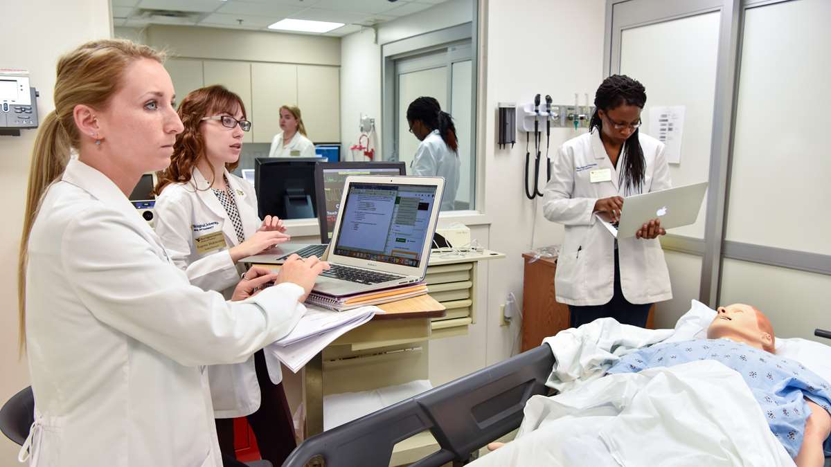 Pharmacy students practice their skills in the WVU Simulation Center.