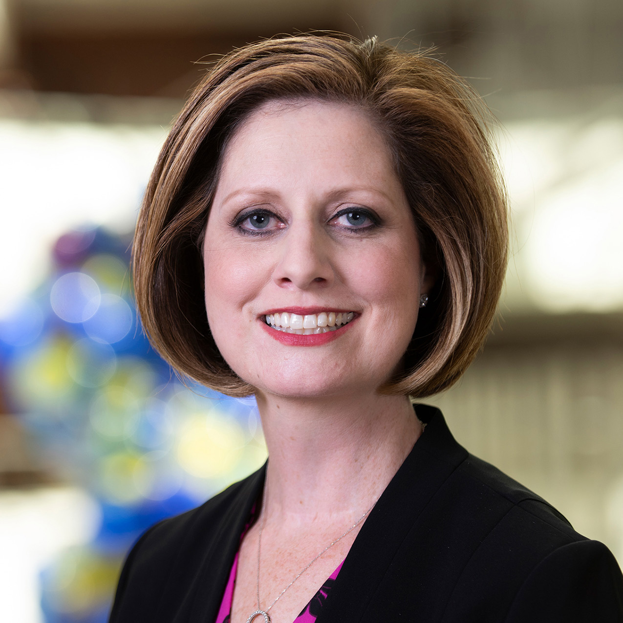 A head shot of Carmella Evans-Molina