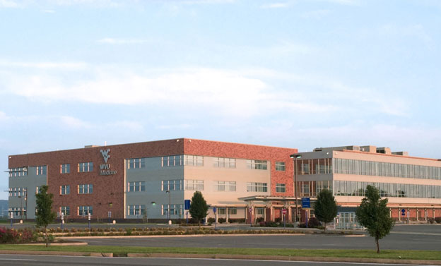 A three quarter view of the front and side of the University Town Center WVU Medicine Facility.